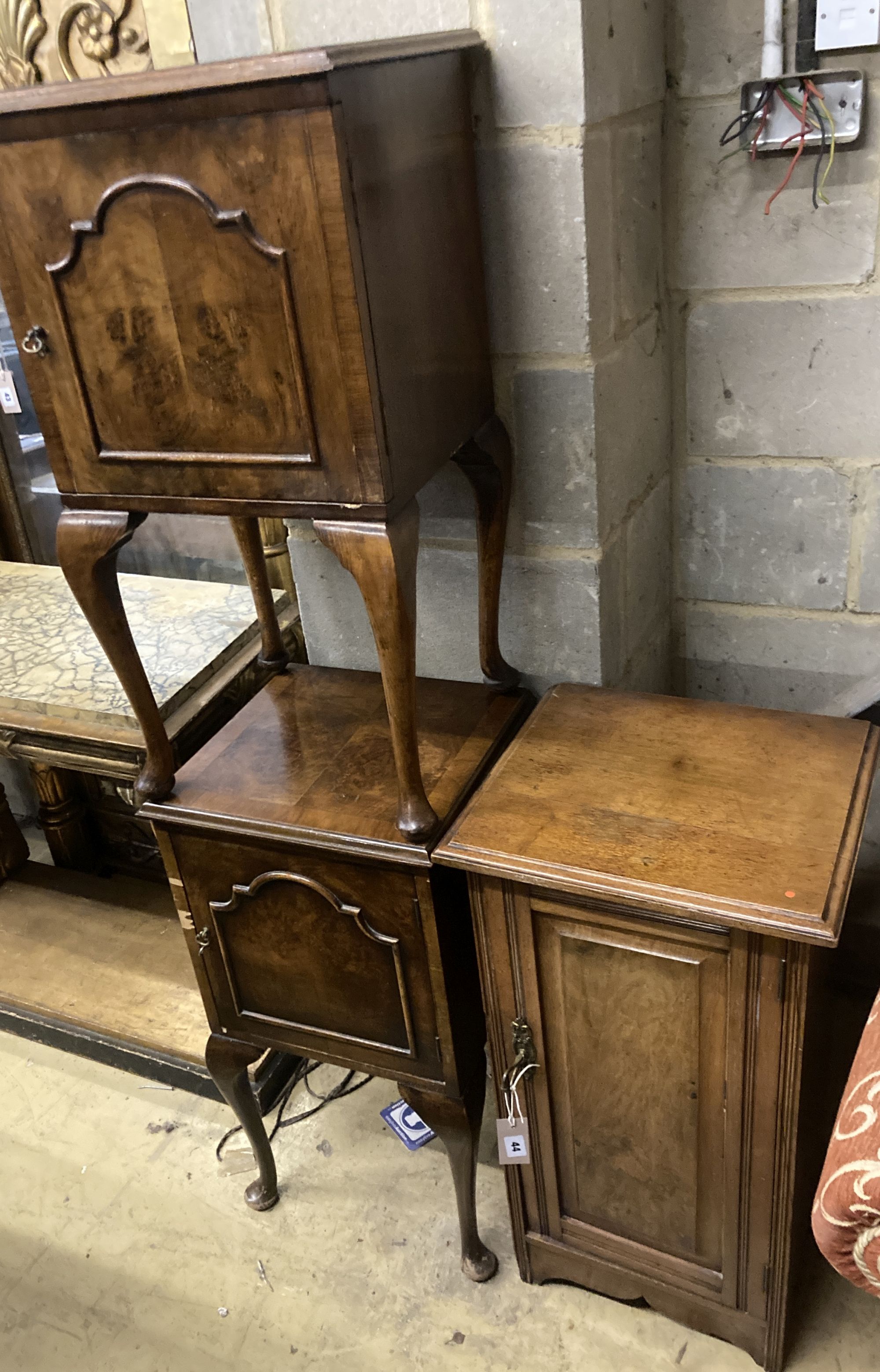 A late Victorian walnut bedside cabinet, width 40cm depth 36cm height 73cm, together with a pair of Queen Anne Revival walnut bedside c